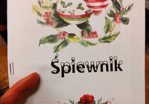 Wigilia grupowa. Okładka śpiewnika z kolędami.